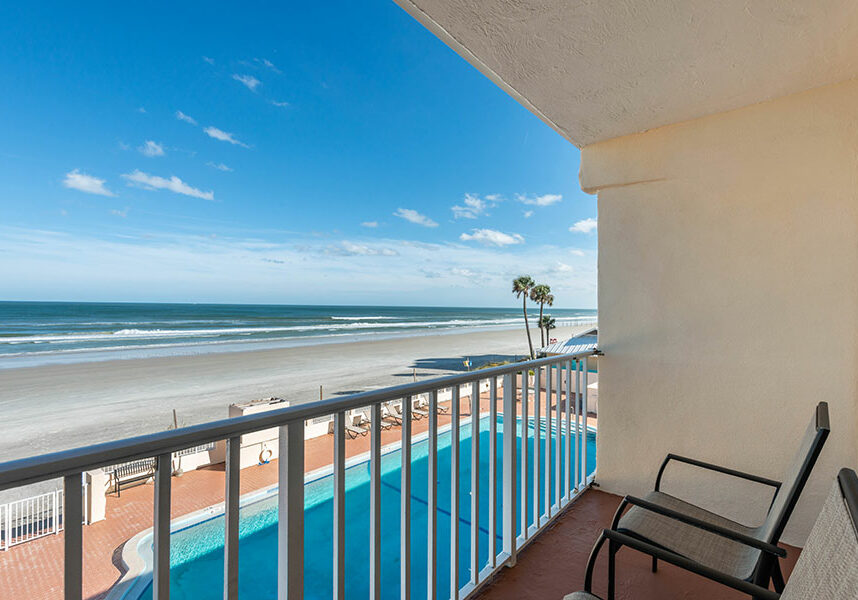 oceanfront two queen beds and one king bed room balcony view at Quality Inn Daytona Beach